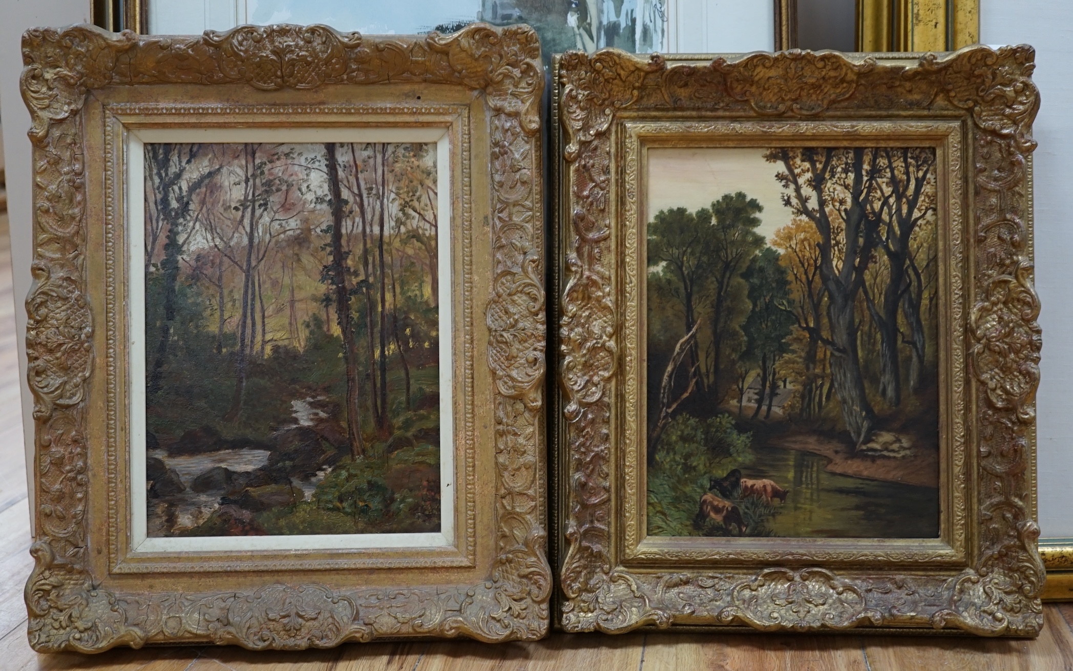 20th century English School, near pair of oils on canvas, Wooded landscapes with streams, 29 x 22cm. Condition - fair to good